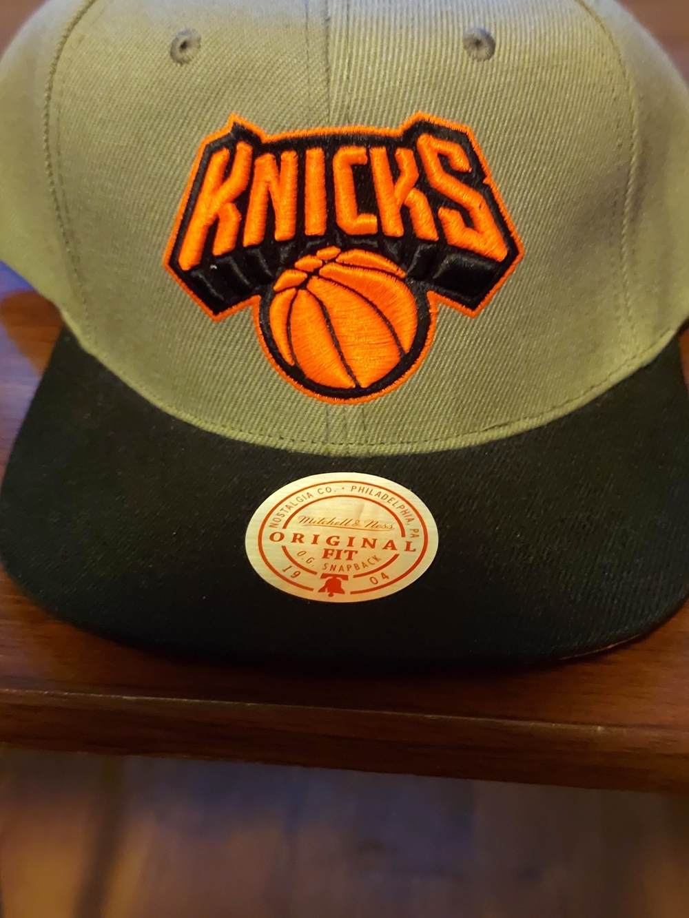 Mitchell & Ness Gray and Black Knicks Snapback Hat with Orange Logo